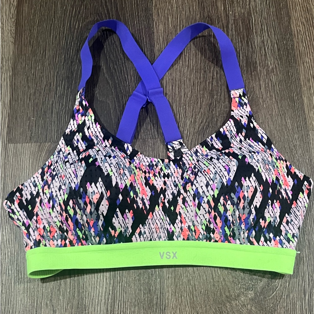 VSX SPORTs bra. 32C multicolor crossed adjustable strapes.